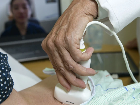 A physician in Bisbee, Arizona, performs an ultrasound while a doctor in Tucson observes remotely via a livestream.