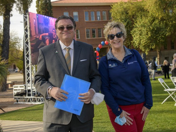 Michael Abecassis, MD, MBA, dean of the UArizona College of Medicine – Tucson, and Jill Hall, manager, alumni and community engagement, enjoy the festive surroundings at the UArizona College of Medicine – Tucson 2022 Match Day event.