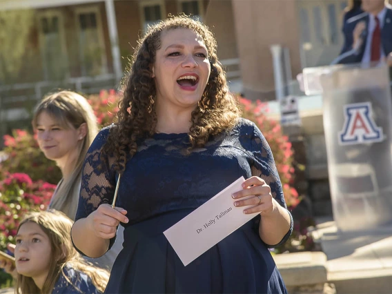 Holly Tallman prepares to open her letter that will tell her where she matched during the UArizona College of Medicine – Tucson 2022 Match Day event.