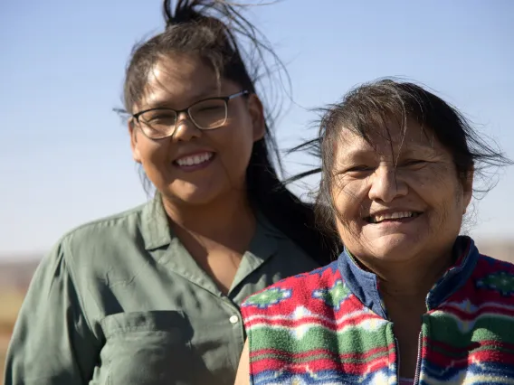 Tiffani Begay and Ida Begay receive donations on the Navajo Nation in early June from the University of Arizona Cancer Center food and supply drive.