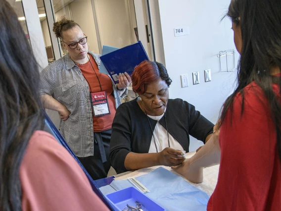 The College of Nursing uses lifelike manikins to practice removing toenails.