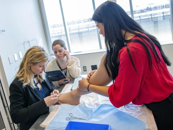 The College of Nursing uses lifelike manikins to practice removing toenails.