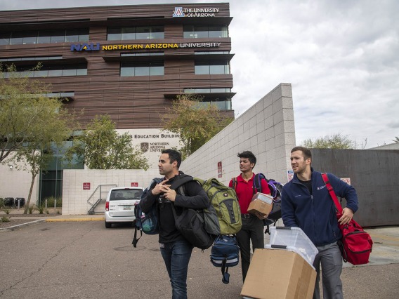 Co-founder Jeffery Hanna, left, student volunteer Eashan Das, center, and co-founder Justin Zeien, right, return supplies to the Street Medicine Phoenix storage area on College of Medicine – Phoenix campus after the Grace Lutheran Church street run.