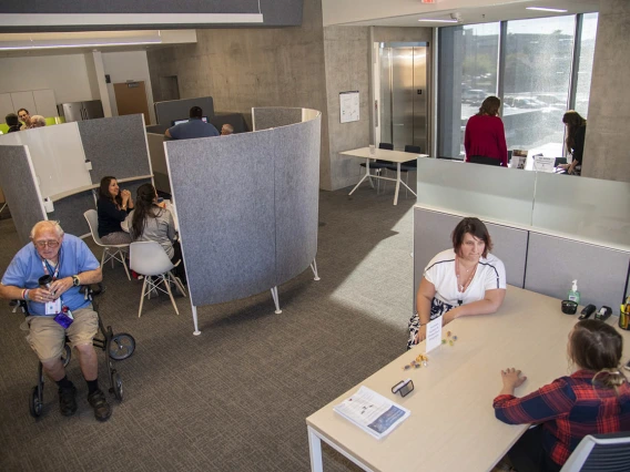 Attendees explore the Faculty Commons + Advisory space inside the Health Science Innovation Building. In early March, the University of Arizona Health Sciences opened space as an innovative gathering place for faculty across the university to meet, collaborate and get advice. 