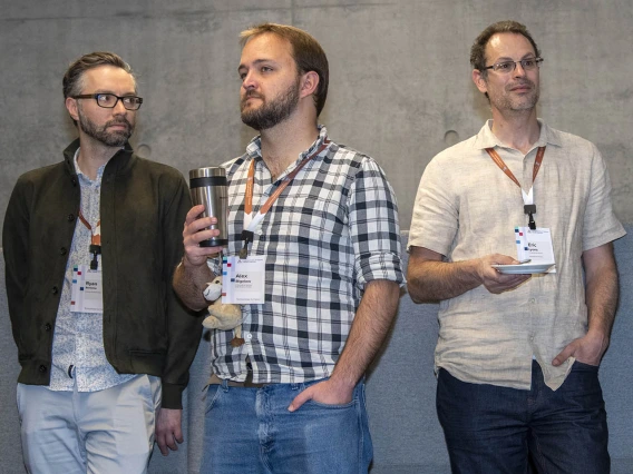 Ryan Bartelme, Alex Bigelow, Eric Lyons listen to University of Arizona Senior Vice President of Health Sciences Michael D. Dake, MD.