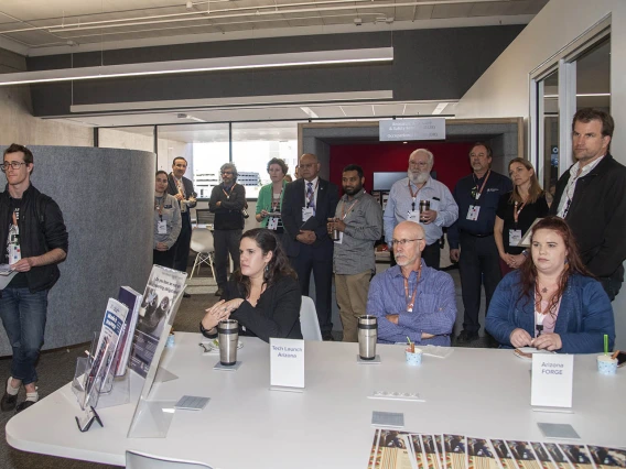 Faculty Commons + Advisory grand opening attendees listen to University of Arizona Senior Vice President of Health Sciences Michael D. Dake, MD. 