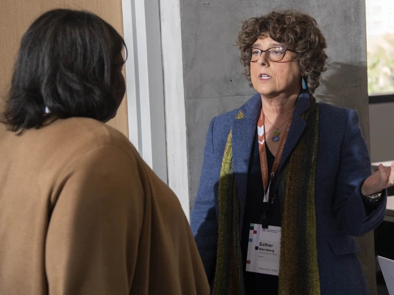 Taren Ellis Langford, JD, of the Conflict of Interest office, speaks to Esther Sternberg, MD, during the grand opening of the Faculty Commons + Advisory event inside the Health Science Innovation Building. 