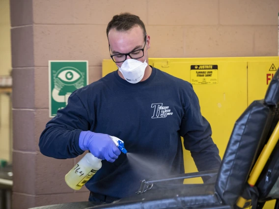 Tucson Fire Department’s Taylor Parrish sanitizes equipment after transporting a possible COVID-19 patient to the hospital. The University of Arizona Mel and Enid Zuckerman College of Public Health worked in conjunction with Tucson Fire Department and the Western Regional Public Health Training Center to create a training video about protocols for first responders to avoid infection during an outbreak.