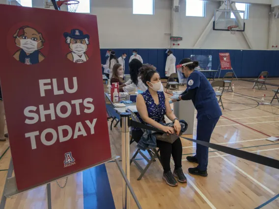 University of Arizona College of Law student Maryam Azimi receives a flu shot from College of Nursing student Abbygail Chavez-Gonzalez inside UArizona Recreation and Wellness Center at Honors Village.