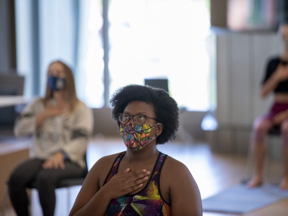 N’Dea Walker practices a breathing technique designed to bring awareness to breath and body and promote mindfulness.