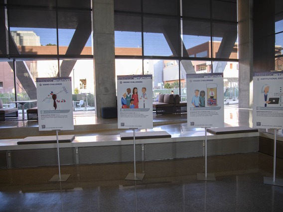 Health Sciences strategic initiatives posters decorate the lobby of the Health Sciences Innovation Building at the town hall event in the Forum, Jan. 28, 2020.