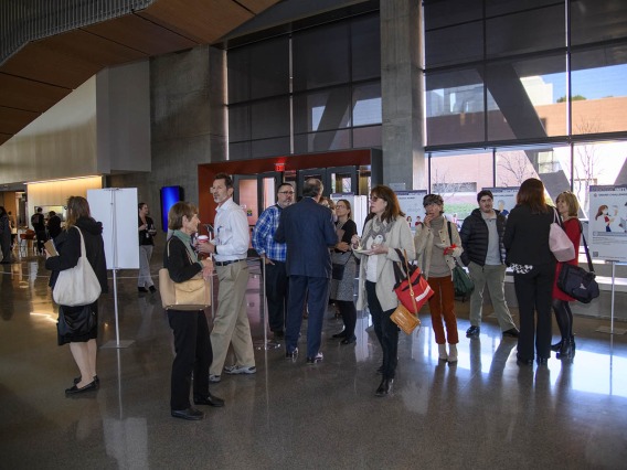 Attendees mingle inside the Health Sciences Innovation Building after the town hall event, Jan. 28, 2020. 