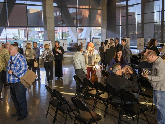 Attendees mingle inside the Health Sciences Innovation Building after the town hall event, Jan. 28, 2020. 