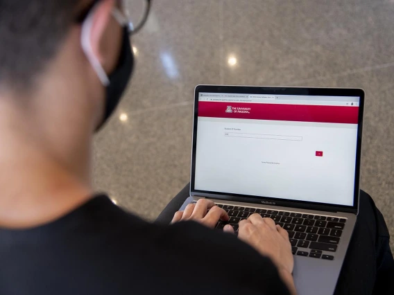 First year College of Medicine – Tucson student Charles Andrew Jauregui checks into Daily Wellness Screening on his laptop before heading to a class. The wellness checks must be completed using the Wildcat WellCheck screening tool, which allows employees and students to self-screen for symptoms.