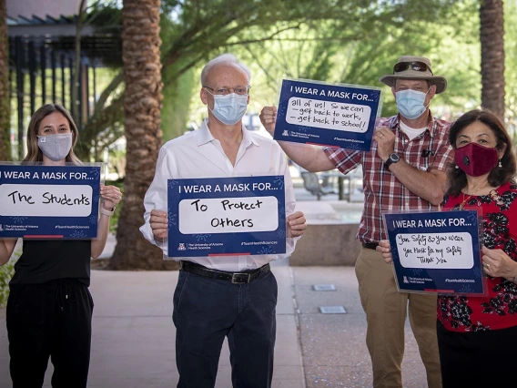 In 2020, the COVID-19 pandemic brought a new awareness to public health prevention measures, including wearing face coverings to prevent the spread of the virus. Pictured from left: College of Pharmacy communicator Ali Bridges; Pharmacy Dean Rick G. Schnellmann, PhD; Mel & Enid Zuckerman College of Public Health communicator Shipherd Reed; Mel & Enid Zuckerman College of Public Health Dean Iman Hakim, MD, PhD, MPH. Each shares why they wear a mask as part of a UArizona Health Sciences “I Wear A Mask” campai