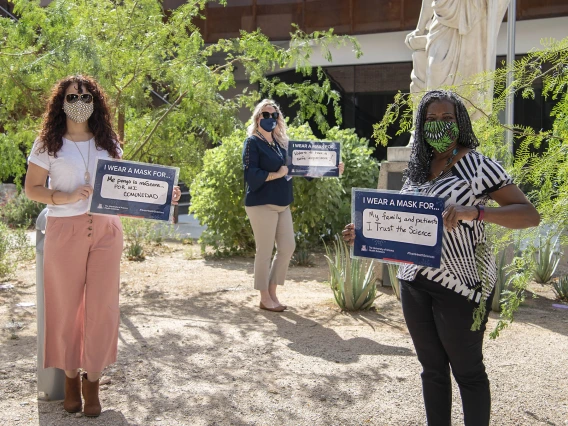 A showing of support for public health protocols from the College of Medicine – Tucson’s Office of Diversity, Equity and Inclusion. From left: Michelle Ortiz, PhD, Rachelle Powell, Victoria Murrain, DO.