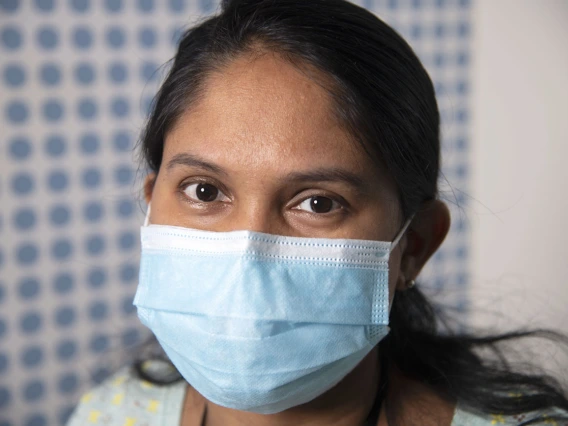 Photographed proudly wearing a mask, Dhanalakshmi Shankara Raman, postdoctoral research associate with the UArizona Center for Innovation in Brain Science poses for the UArizona Health Sciences “I Wear a Mask” campaign.