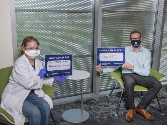 Mandi Corenblum, MS, lab manager and research specialist, and Mark Drew, PhD, translational project manager at the Center for Innovation in Brain Science.