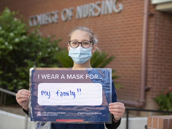 On the Tucson campus, College of Nursing student Tori Hyson wears a mask for her family. 