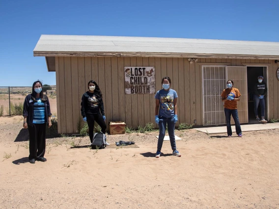 Vanessa Jensen, MD, stands with volunteers who help distribute supplies at a community center in Tuba City. 