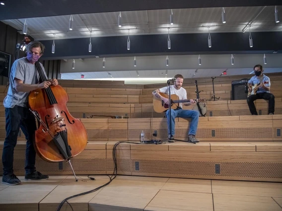 Tucson-area country and Americana artist Freddy Parish (center) performs in the University of Arizona Health Sciences Innovation Building for The Tucson Studio, a new program of UA Presents. Joining with Parish is bassist Thøger Tetens Lund and guitarist Nathan Fenoflio.