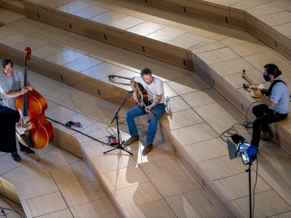 Freddy Parish performs in the Forum (center), with bassist Thøger Tetens Lund and guitarist Nathan Fenoflio. 