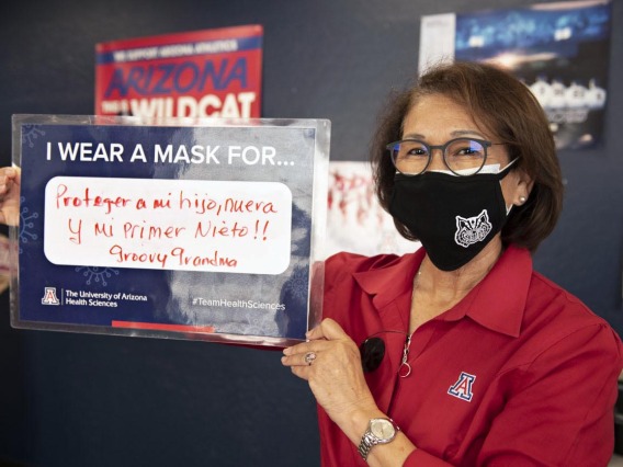 Cecilia Rosales, MD, MS, wears a mask to protect her first newborn grandchild. Dr. Rosales is an associate dean, professor and chair of the Division of Public Health Practice & Translational Research at the Mel and Enid Zuckerman College of Public Health on the Phoenix Biomedical Campus. 