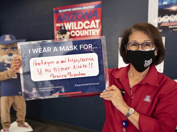 Cecilia Rosales, MD, MS, associate dean, Phoenix Campus, shares that she wears a mask to protect her first newborn grandchild during the COVID-19 pandemic in 2020. 