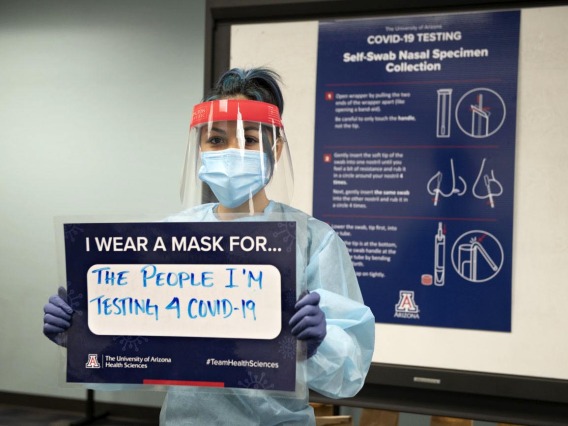Taking a break from her work testing the UArizona community on the Phoenix campus, Shannon Espinosa, RN, UArizona alumni, says she wears a mask “for the people I’m testing for COVID-19.”