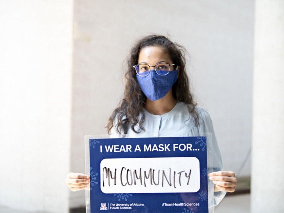 First-year College of Medicine – Phoenix student Prathima Harve holds a sign that says she wears a mask for her community. Harve is one of 32 students from the Colleges of Medicine in Tucson and Phoenix to be awarded a Primary Care Physician Scholarship this fall. 