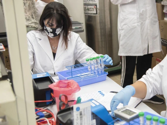 Lab tech Jennifer Alvarado places a cassette into the machine and waits 11 seconds for a result. 