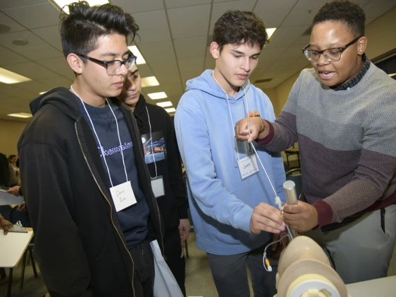 An anesthesiology specialist gives a demonstration on intubation.