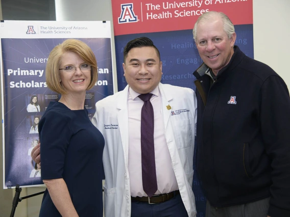 Rep. Heather Carter, Primary Care Physician scholarship recipient Jasper Puracan and University of Arizona President Robert C. Robbins, MD, pose for a photo.