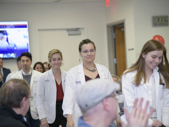 Primary Care Physician scholarship recipients walk in for the start of the reception. 