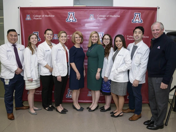 A group photo of Primary Care Physician scholarship recipients and community members.