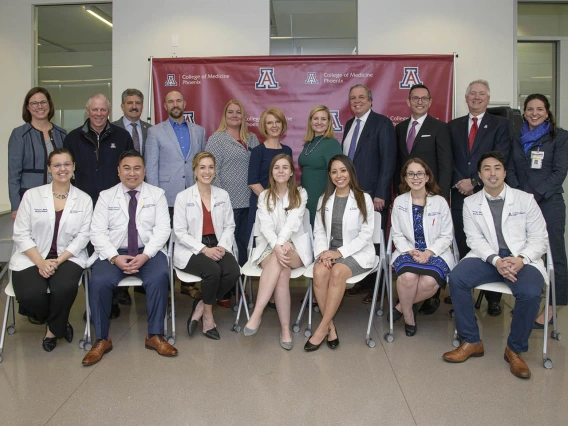 A group photo of Primary Care Physician scholarship recipients, University of Arizona staff and community members.