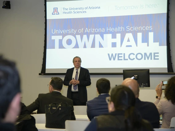 Senior Vice President for Health Sciences Michael D. Dake, MD, welcomes the audience to a town hall event in Phoenix.