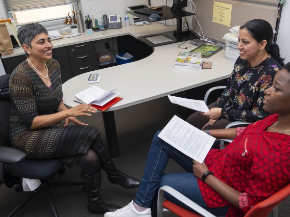 (Left) Purnima Madhivanan, PhD, MBBS, MPH, an associate professor of health promotion in the Mel and Enid Zuckerman College of Public Health, meets with two of her mentees, (center) Kiranmayee Muralidhar, MMBS, MPH, and Namoonga Mantina, both doctoral students, to discuss progress on their research manuscripts. Madhivanan is currently mentoring about 35 people. 
