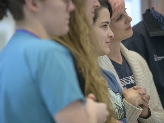 Members of Doc-acapella listen to other speakers.