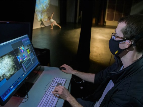 To produce StellarScape, data is collected from the sensors and processed in near real-time by a computer, providing the audience with the allusion that the dancer is creating the movements of particles on the video screen in the background.