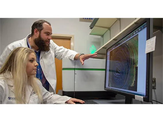 Curtis Thorne, PhD, assistant professor, cellular and molecular medicine, and one of his doctoral students, Carly R. Cabel.