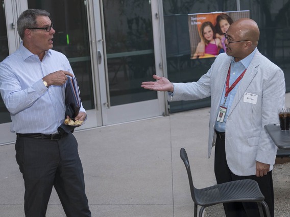 (From left) Craig Woods, DVM, MS, MBA, director of Infectious Disease and Biosecurity Projects at Arizona State University, and Art Lee, JD, vice president and deputy general counsel for UArizona, visit after the UArizona Health Sciences Tomorrow is Here Lecture Series in Phoenix. 
