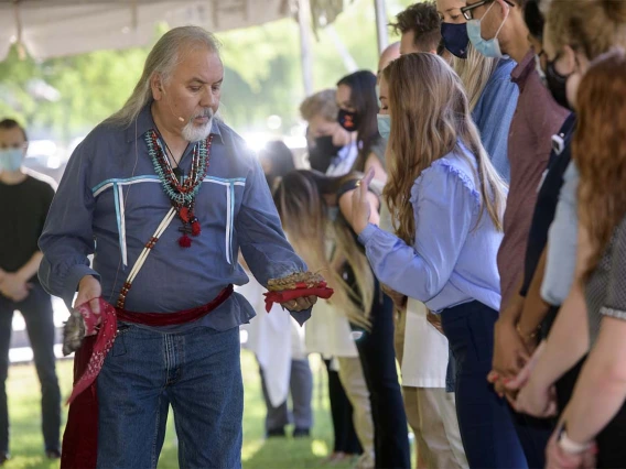 The herbs used in the smudging ceremony are white sage, soft sage, sweetgrass, creosote leaves, copal, cedar and wild tobacco.