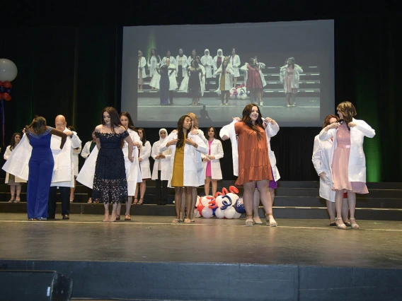 Members of the R. Ken Coit College of Pharmacy class of 2023 receive their white coats during a ceremony at Centennial Hall.  