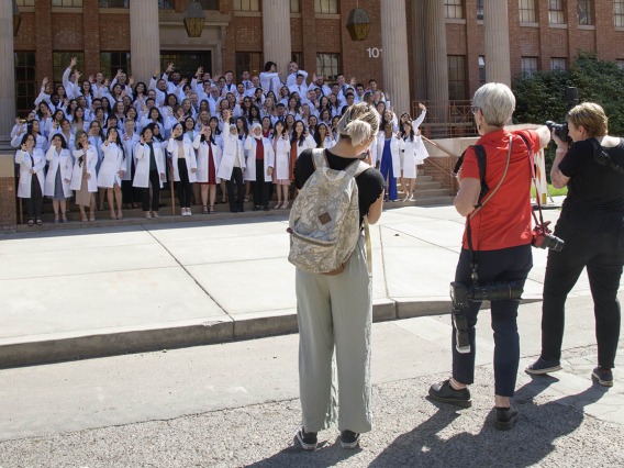 Photographers capture the moment for R. Ken Coit College of Pharmacy class of 2023 after their white coat ceremony.
