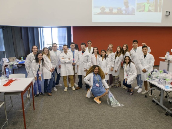 UArizona College of Medicine – Tucson first-year medical students pose for a group photo after being fitted for their white coats inside the Health Sciences Innovation Building prior to the white coat ceremony.