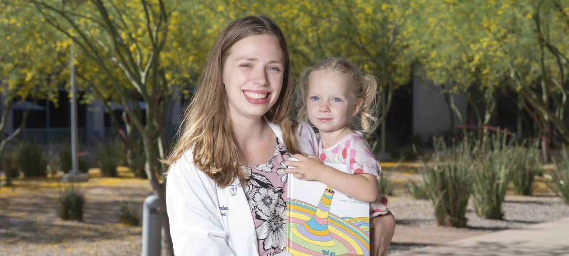 mother holding young daughter