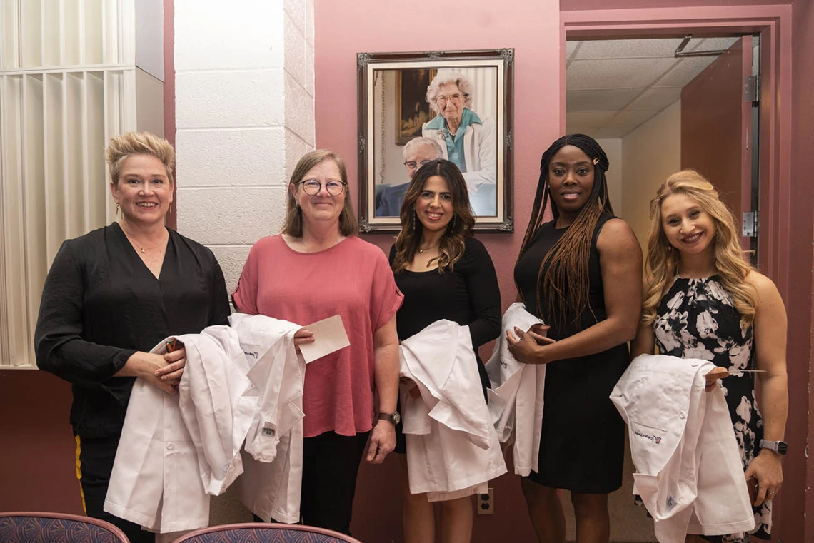 DNP students prepare to walk into the UArizona College of Nursing Doctor of Nursing Practice white coat ceremony.