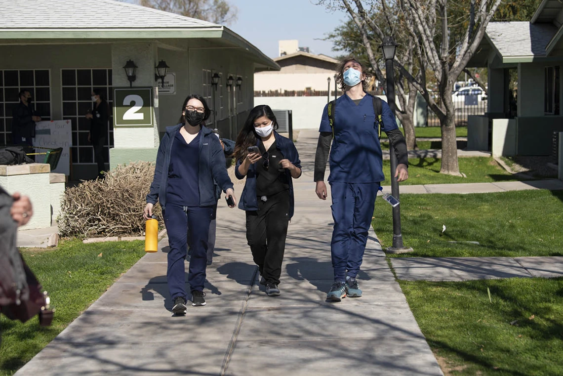 College of Medicine – Phoenix classmates Alexis Montoya, Bernice Alcanzo and Colton Cowan leave El Mirage Senior Housing complex, where they helped implement a pilot COVID-19 vaccine distribution program.