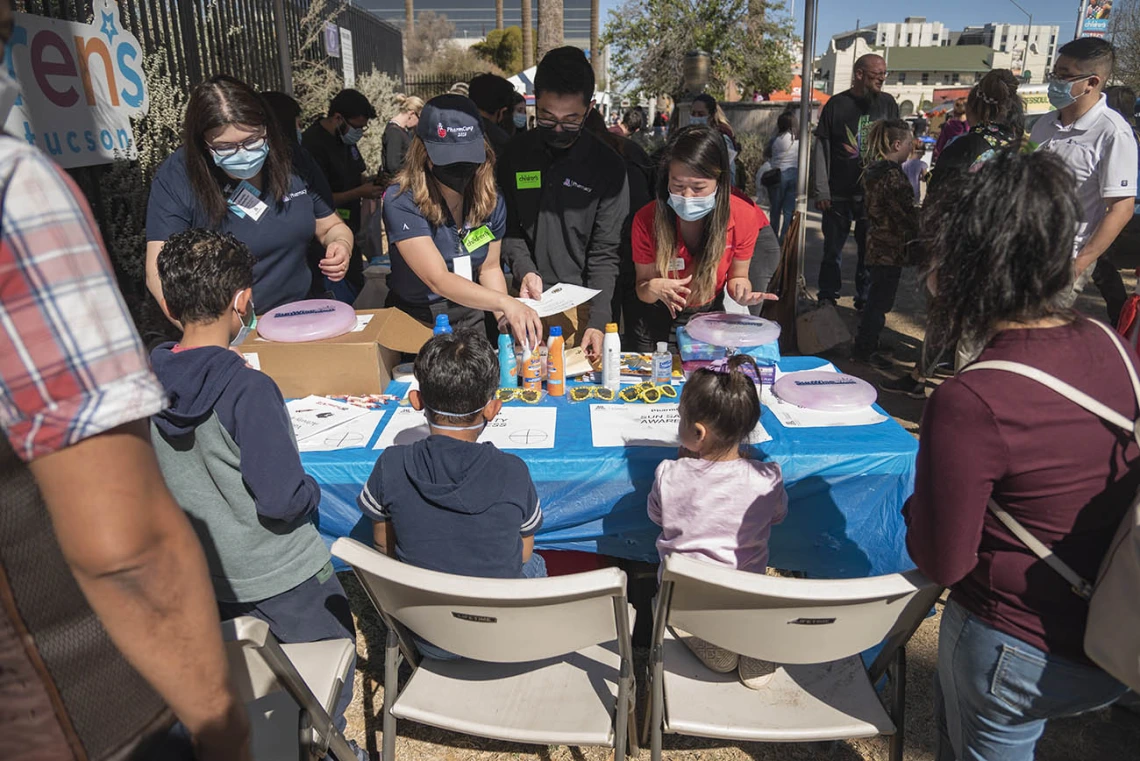 University of Arizona R. Ken Coit College of Pharmacy students teach children about sun safety during the recent Family SciFest at Children's Museum Tucson.